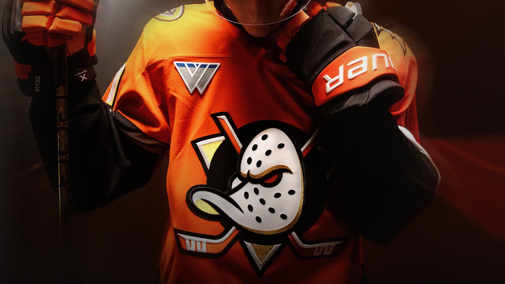 Dramatic photo of an Anaheim Ducks player in the new 2024–25 home uniform.